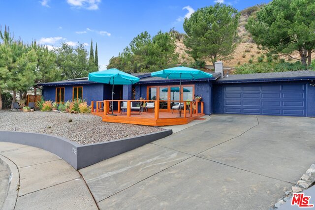 1205 Pleasantridge Dr Altadena, California Nestled in Rubio Highlands, a highly sought after enclave in the hills of Altadena, is this move-in ready 3 bedroom, 2 bathroom single level home on a large, drought tolerant landscaped hillside lot. The well thought out open floor plan lends itself to an indoor/outdoor lifestyle with a bright and airy great room with a dramatic fireplace and direct access to multiple outdoor spaces including a large deck that is perfect for entertaining and to enjoy the beautiful mountain and city views. The cooks kitchen flows seamlessly with the main living space and features maple cabinets, granite counter tops, a large island, and stainless steel appliances. Additional Features include hardwood floors, recessed lighting, solar panels, direct-access two-car garage with storage space, and a large master with an en-suite bathroom and that opens up to an intimate garden. This lovingly maintained Altadena gem is a must see home in a highly sought after neighborhood where properties seldom become available!