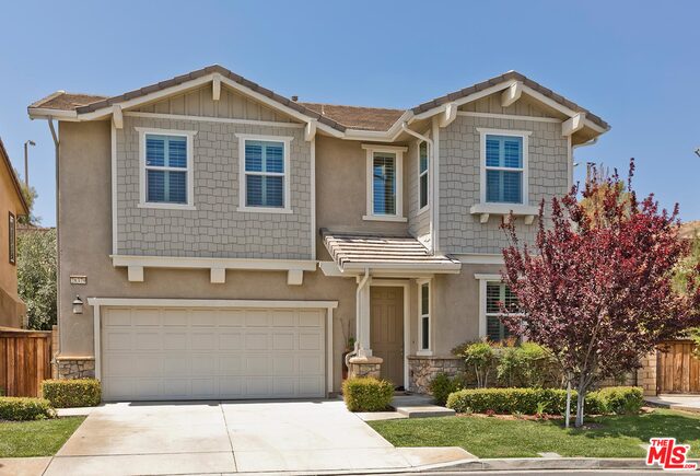28379 Esplanada Dr Santa Clarita, California Gorgeous Home with an Open Floorplan in the very Desirable Valencia West Creek Community of Estrella, Featuring SunPower Solar System and Tons of Upgrades. Beautiful Wood Floors throughout, Brand New Carpet upstairs, and Professionally painted walls, plus upgraded Lighting Fixtures. Great Room Fireplace and Dining Area. Gourmet Kitchen w/ Beautiful Espresso Cabinets, Stainless Steel Appliances including a double oven, Granite Counter-tops, Full Granite Back-splash and Large Center Island. 4 Bedrooms, 3 Full Bathrooms, Downstairs has one Full Bedroom, Full Bathroom. Large Master Bedroom Suite w/ Large Walk-in Closet and Extra Linen Closet, Master Bathroom has Granite Dual Vanity & Upgraded Tile Surround in Shower & Spa Tub, All Bathrooms have Upgraded Tile Flooring, Granite Counter-tops & Brush Nickel Finishes, Good sized Secondary Bedrooms upstairs plus a Large Loft, Upstairs Laundry Room. This Home has an oversized Backyard for the tract, complete w/ patio cover, Kids Playset and Plenty of Grass to Play or Garden. 2 Car Garage that can easily be used as a Gym as well. The West Creek HOA has two Pools / Spas, Clubhouse, Serene Walking Paths, Tennis, Basketball Courts & Park. PLUS, the Highly Acclaimed West Creek Academy is within a short Distance.