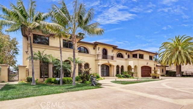 No expense was spared in building this One of a Kind Mediterranean Estate in the secluded neighborhood of Lunada Pointe, impeccably designed with a flawless balance of luxury and comfort. An aesthetic stone-paved driveway welcomes you to the grand entrance where you are greeted by a soaring 2-story foyer adorned with intricate railings & matching skylights. A luxury loggia automatically draws you to the panoramic ocean view, offering a seamless transition for indoor/outdoor entertainment & living. The formal living room has a stately fireplace & wet bar, while the family room has a built-in entertainment center for daily enjoyment. An elegant office with view & built-in shelves provides the ideal place for work & study. The massive kitchen with a large center island is equipped with high-end chef grade appliances and a 2nd kitchen for additional/special cooking needs. Meals can be served casually in the breakfast bar, breakfast nook or formally in the dining room with an adjacent butler station. A maid s quarter is nearby for added convenience. Meanwhile, a main floor view bedroom en-suite that opens to the beautiful backyard is on the other side of the house, perfect for guest or in-laws. Outside, you will find a swimming pool /spa, lounge area, BBQ station & outdoor dining area amid the landscaped backyard. On the UPPER LEVEL is a grand master suite with expansive view and a covered view balcony, walk-in closet and a huge bathroom with double vanity & double privacy toilet chambers. There are 3 more view bedroom en-suites with view balconies on this level, along with an exercise room, den & a music room. On the LOWER LEVEL is a huge entertainment center, wine collection room, wet bar & recreation area. With 6 bedrooms and 10 bathrooms, this gorgeous home also boasts 1 automatic generator, 2 staircases, 3 fireplaces, 4 wet bars and 7 HVAC units. Other fine appointments include high ceilings, large picture windows, designer wrought iron works, expansive premium flooring, venetian paint & luxury wallpapers and lots of custom built-ins. Witness the whales migrating & mesmerized by the amazing sunsets over the blue ocean from this luxury mansion. This estate is just minutes from shops/restaurants, Terranea Resort and 4 world class golf courses of PV. A rare opportunity to own a trophy location where the luxurious lifestyle & location are hard to match anywhere.